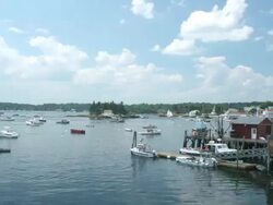T/L boats moving around harbour and with tide, Boothbay harbour, Maine, USA Stock Footage