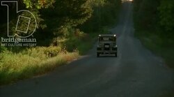 Car driving through the countryside, 1930s - reenactment, clip 4 Stock Footage