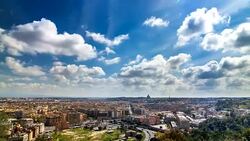 Wide angle timelapse of blue clouds over the Rome and Vatican's Saint Peter's basilica Dome. Rome, Italy. April, 2016. Stock Footage