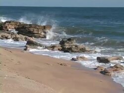Rocky Shoreline Zoom Out Stock Footage