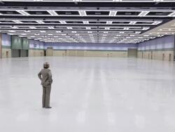  WS Businesswoman walking into large empty conference facility, looking around, and then leaving / Seattle, Washington, United States Stock Footage