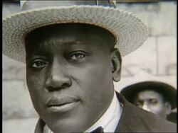 B/W close up of black man in straw hat / Jack Johnson (boxer) Stock Footage