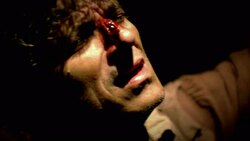 A prisoner with a bloody nose grimaces on a torture rack during a reenactment of the Inquisition. Stock Footage