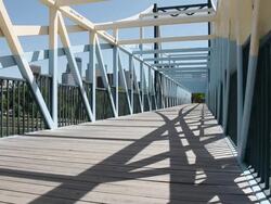 MS Well dressed young man riding skateboard over bridge in urban area / Minneapolis, Minnesota, United States Stock Footage