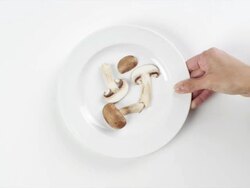 CU Woman hand entering setting down round white plate with cottage cheese, pepper and tomato slices / Omaha, Nebraska, United States Stock Footage