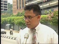 Malaysia - Central bank fixes exchange rate News Clip