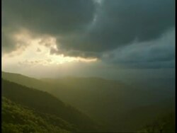 T/L shafts of Sunlight over Mountains, Craggy Gardens, Blue Ridge Parkway, Blue Ridge Mountains, North Carolina Stock Footage