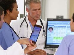 MS Medical Workers Updating and Discussing Patient Records in Hospital / Richmond, Virginia, USA Stock Footage