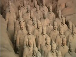 CU Terracotta Warriors, zooms out to WA view of army, zooms back in to CU, Museum of Qin, Xian, China Stock Footage