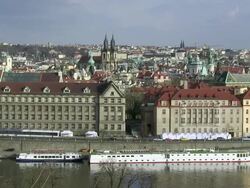 WS Cars and people moving on street near vltava river and old town / Prague, Hlavni mesto Praha, Czech Republic Stock Footage
