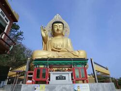 MS POV Shot of Jwabulsang Statue in Sanbanggulsa Temple / Jeju-do, South Korea Stock Footage