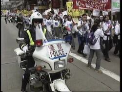 Foreign maids protest against possible cut in minumum wage News Clip