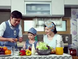 MS Parents with children preparing for dinner in kitchen / Seoul, South Korea Stock Footage