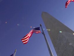 A tracking shot looking up at the Washington Monument on a windy day in Washington DC. Stock Footage