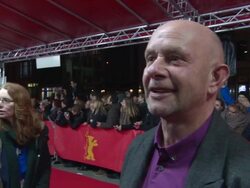 INTERVIEW - Nick Hornby on his books turning into films, how long the process is, his wife being the Producer, on the film at 'A Long Way Down' Red Carpet at Friedrichstadt-Palast on February 10, 2014 in Berlin, Germany. Stock Footage