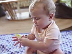 CU Shot of baby boy eating piece of fruit / Ubud, Bali, Indonesia Stock Footage