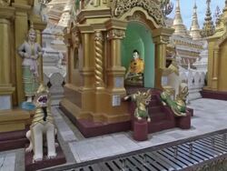 Colorful, religious statues in the Shwedagon in Yangon, Myanmar Stock Footage