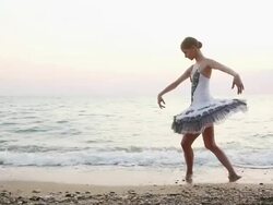 ballerina in the evening coast Stock Footage