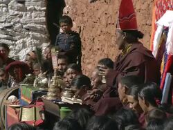 MS Local woman in traditional costume at tibetan buddhist religious ceremony / Saldang village, High Himalayas, Upper Dolpo near Tibetan border, Nepal   Stock Footage