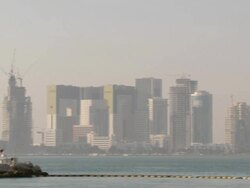 WS PAN View of Modern buildings in Doha and boats floating on the sea / Doha, Qatar  Stock Footage