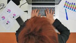 Top view of Businesswoman working with laptop,Panning shot Stock Footage