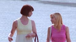 SLO MO Female friends walking down street after shopping spree Stock Footage