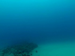 WS TD Shot of Open ocean water and rocky outcrop / Matola, Maputo, Mozambique Stock Footage