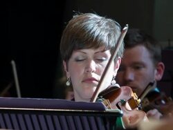 Violinist playing in a symphony orchestra Stock Footage