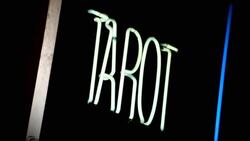 A neon sign reads, 'Tarot Card Psychic.' Stock Footage
