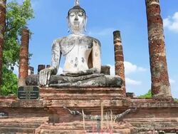 Crane shot: Big buddha in Sukhothai historical park Thailand Stock Footage