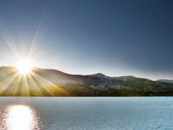 Sun over mountain and river Stock Footage