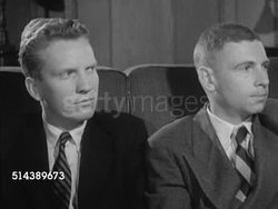 1953: YALE UNIVERSITY SEMINAR: VS Trumbull College, Calhoun College, & Berkeley College buildings. INT VS Senior students gathered around, smoking cigarettes, listening to John Colt reading excerpt from novel during seminar (SOT). English Instructional Video