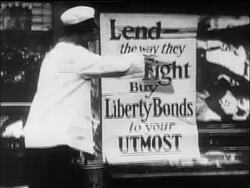 B/W 1910s women pasting up poster to buy Liberty Bonds / WW I / documentary Stock Footage