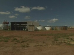 Water tanks and shed in outback, Mungalalu Truscott Airbase, WA, Australia Stock Footage
