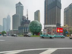 Daytime Timelapse of Busy Traffic Around Friendship Square, Dalian, China (Ground View) Stock Footage