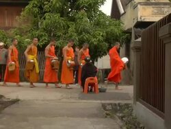 ZI line of monks collecting alms / Luang Prabang, Laos Stock Footage