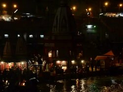 MS People praying in ganges river bank at night / Haridwar, Uttarakhand, India Stock Footage