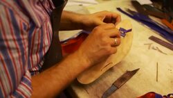 the shoemaker repairs a shoe Stock Footage