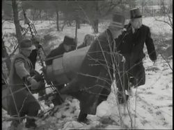 A group of men in costume carry pitchforks and set up a weather device to celebrate Groundhog Day. News Clip