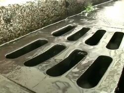 Close up manhole under rain \Seamless LOOP HD\ Stock Footage