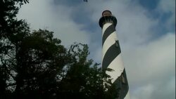 Clouds pass over a lighthouse in St. Augustine, Florida. Stock Footage