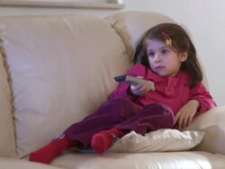 HD: Home Alone Watching TV Stock Footage