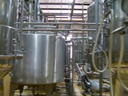 MS PAN Shot of boiling tanks in brewery / Wau, Western Bahr el Ghazal, Sudan  Stock Footage