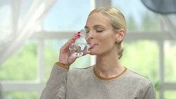 Woman drinking water Stock Footage
