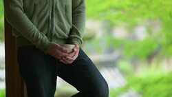 Young Japanese man holding Japanese tea at the temple. Kyoto, Japan. Stock Footage