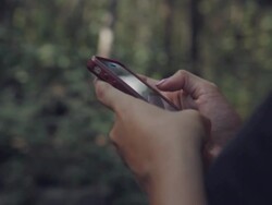 girl using smartphone search website in a forest Stock Footage
