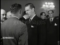 1943: KING CAROL II OF ROMANIA: WS Americans in reception. MS King Carol II of Romania (1893-1953) talking w/ men. CU Elena 'Magda' Lupescu (1896-1977) talking at reception. Mexico. (both Carol II & Lupescu possibly in exile). Instructional Video