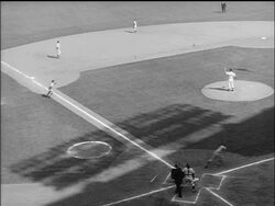 B/W 1955 high angle batter running to first base / man running home from third base / World Series Stock Footage