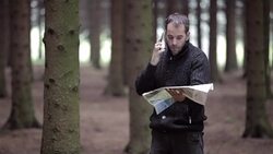 Lost angry man with a map searching directions Stock Footage