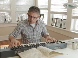 Mixed race man playing keyboard Stock Footage